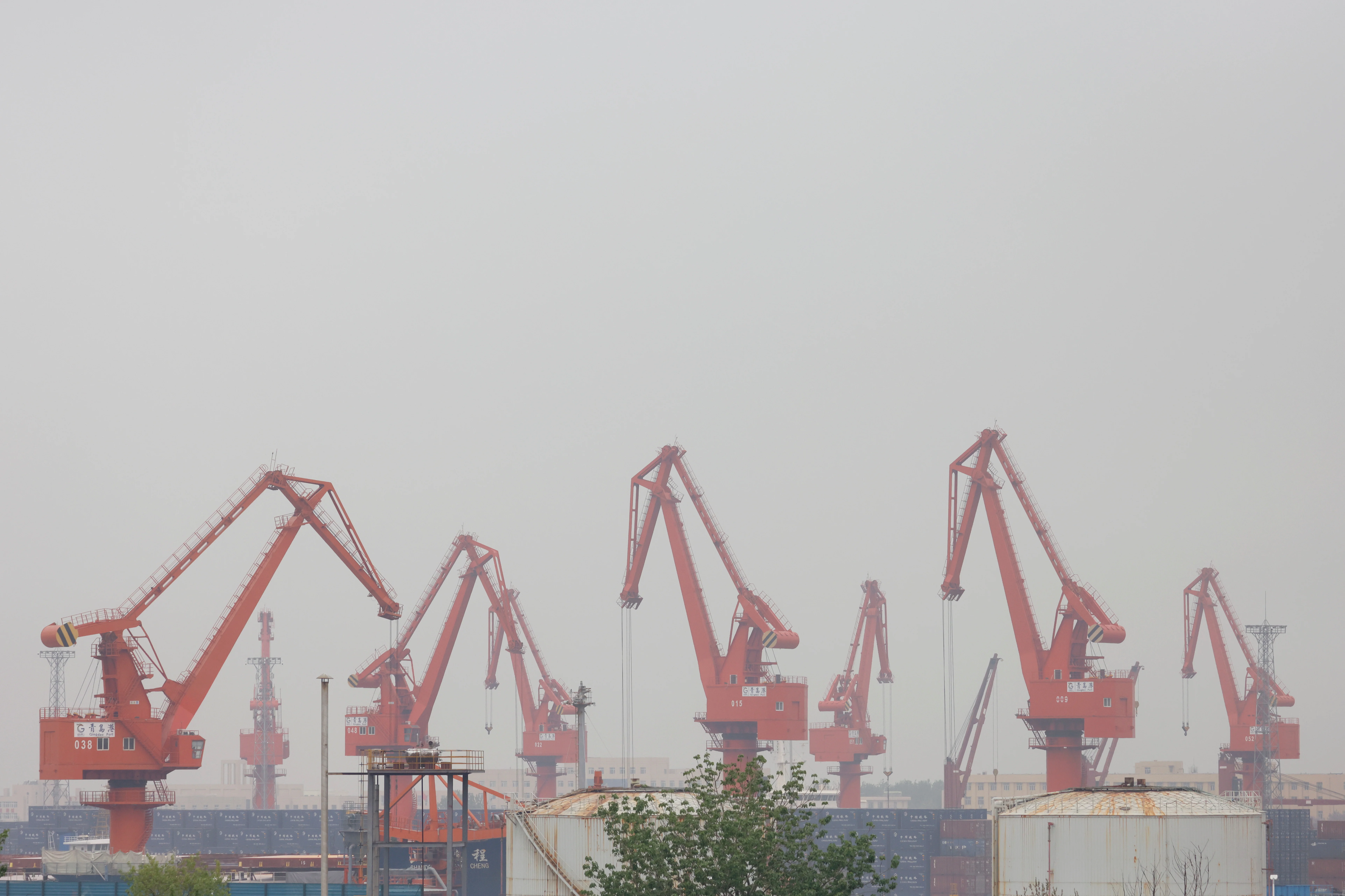 Chinese cranes towering over a U.S. port.